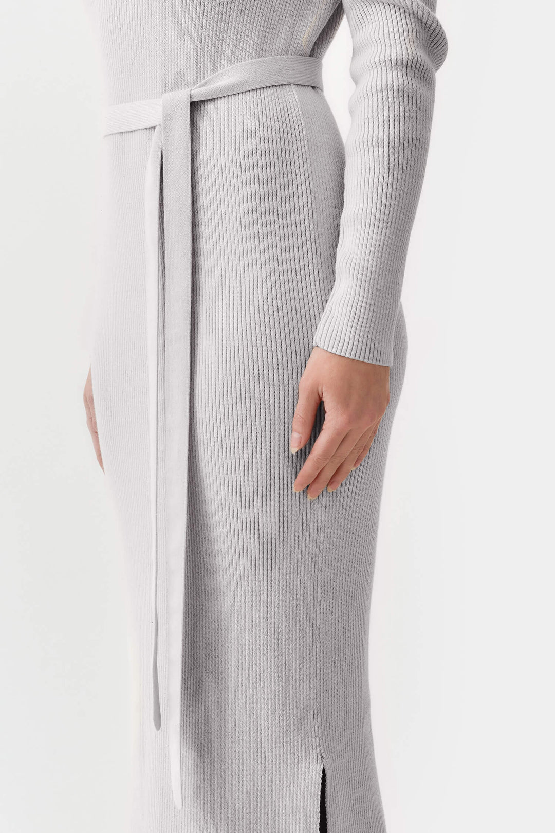 Grey knitted organic cotton maxi dress, offering a relaxed fit with long sleeves and a sustainable, timeless silhouette.